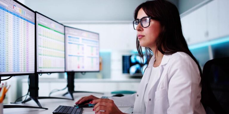 Woman looking at computer screenings